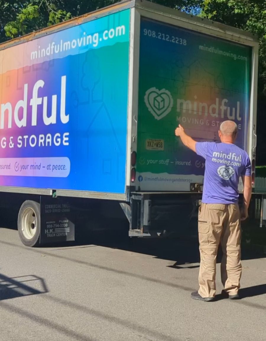 Mindful moving truck and a team member. 